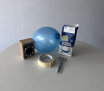 Material Experiment des Monats: Sichtbare Schallwellen (Lautsprecher, Luftballon, Schere, Klebeband, Zucker)